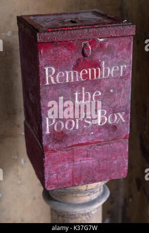 A Remember the Poors Box located at St. Bartholomews Hospital in London, UK.  Before the National Health Service, the sick were dependent on charity a Stock Photo