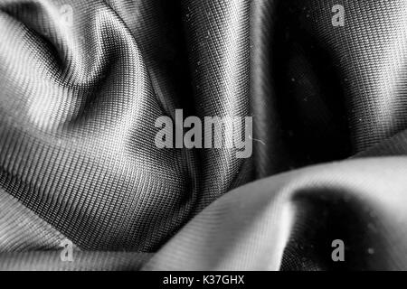synthetic black carbon fiber textile fabric background. Stock Photo