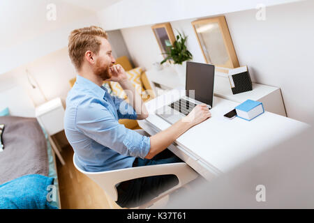 Self employed businessman working from home Stock Photo