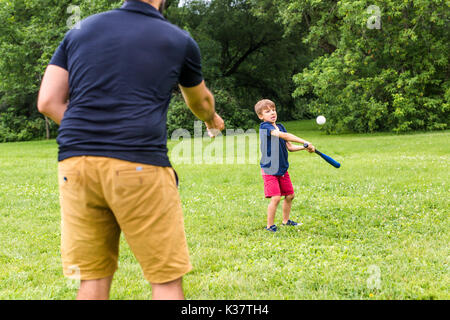 Happy father and his son playing baseball Stock Photo