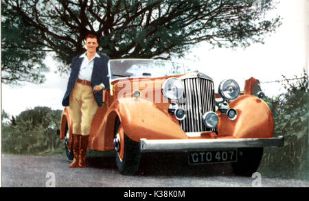 Actor DIRK BOGARDE with his 21 horsepower special-bodied convertible SUNBEAM TALBOT,one of only twenty made Stock Photo