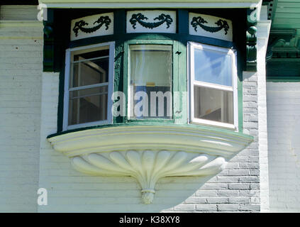 Nineteenth century brick house triple bay window Stock Photo