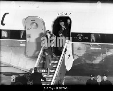The Queen Mother, Princess Margaret, Prince Charles and Princess Anne leave the BOAC Argonaut Atalanta G-ALHK at London Airport. They had just bid farewell to The Queen and the Duke of Edinburgh on their trip to Nigeral in 1956 Stock Photo