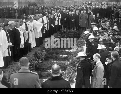 Mourners surround the mass grave as the 44 victims of a German bombing ...