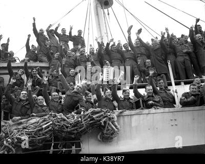 British soldiers waving as troop ship sets sail for France during WW2 ...