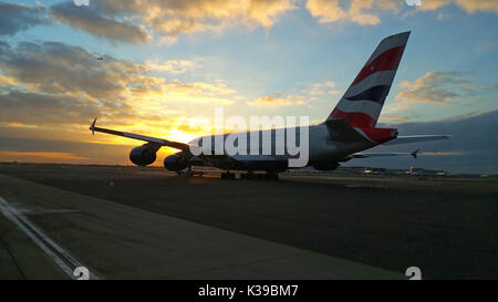 British Airways A380 Airbus aircraft G-XLEG under tow at sunset at London Heathrow Airport Stock Photo