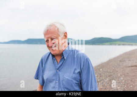 Senior Man at the beach having good time Stock Photo