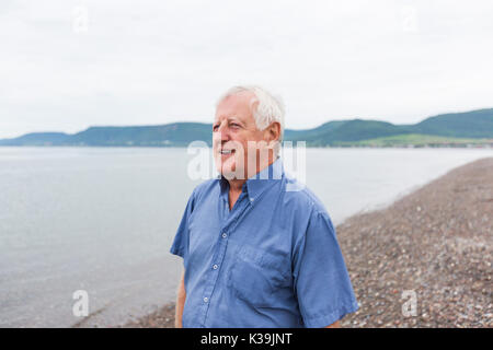 Senior Man at the beach having good time Stock Photo