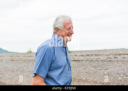 Senior Man at the beach having good time Stock Photo