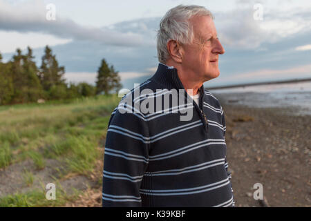 Senior Man at the beach having good time Stock Photo