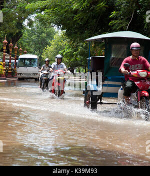 Traffic continues during flood in Phnom Pehh, Cambodia on Oct 9, 2011 Stock Photo