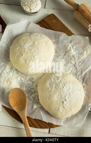 Raw Organic White Pizza Dough Ball with Flour Stock Photo