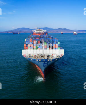 container-ship carrier is in the bay in anticipation of unloading Stock Photo