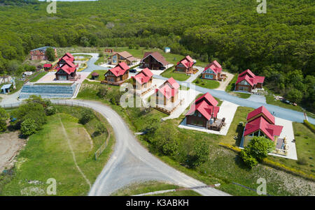 new village of houses built from a beam of one project Stock Photo