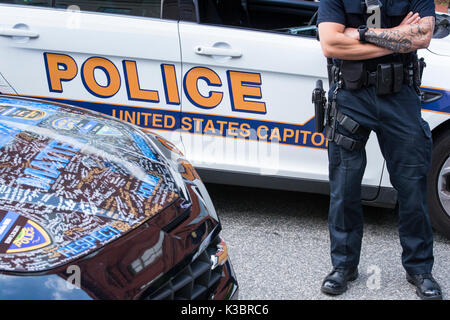 United States Capitol Police car with cop in full gear and pistol standing. Blue Lives Matter custom car hood with signatures to honor law enforcement Stock Photo