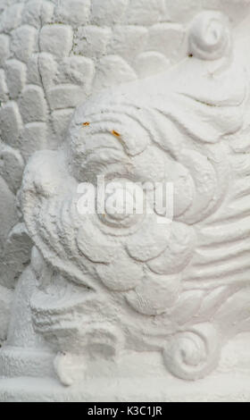 silhouette of koi fish engraved in white iron Stock Photo