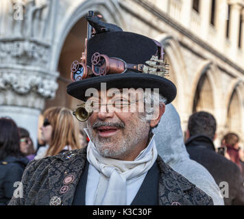 Venice, Italy- February 18th, 2012: Environmental portrait of aa eccentric man funny disguised during the Venice Carnival days. Stock Photo