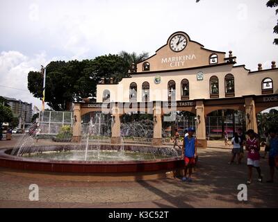 MARIKINA CITY, PHILIPPINES - AUGUST 28, 2017: A water fountain at an outdoor park and an architectural design outside a sports stadium in Marikina Cit Stock Photo