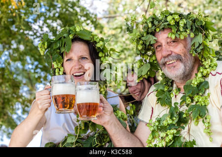 Czech beer festival people drinking beer Czech Republic beer plants people decorated with a hop wreath Man and woman Stock Photo