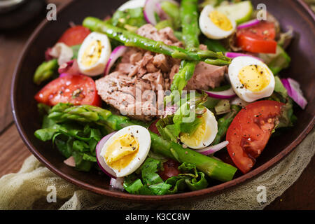 Salad with tuna, tomatoes, asparagus and onion. Salad Nicoise Stock Photo
