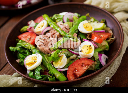 Salad with tuna, tomatoes, asparagus and onion. Salad Nicoise Stock Photo