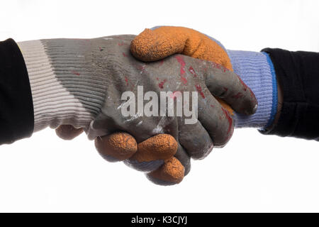 Isolated workers hands shaking hands and wearing gloves. Stock Photo