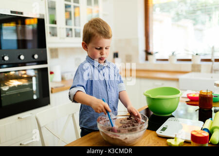 Cute child learning to become a chef Stock Photo