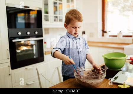 Cute child learning to become a chef Stock Photo