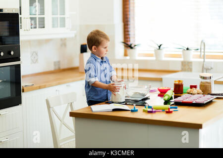 Cute child learning to become a chef Stock Photo