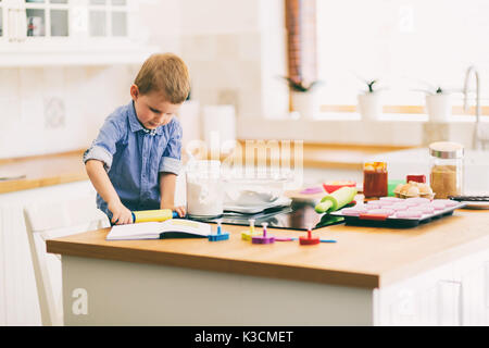 Cute child learning to become a chef Stock Photo