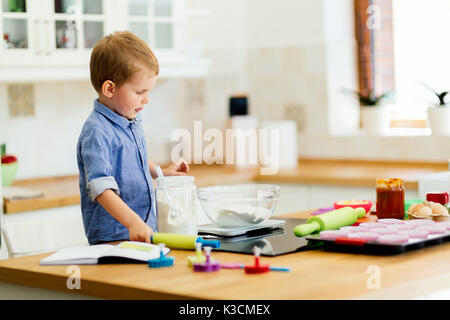 Cute child learning to become a chef Stock Photo