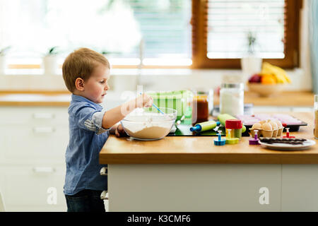 Cute child learning to become a chef Stock Photo