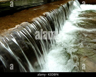 small waterfall, artificial cascade on the river, Stock Photo
