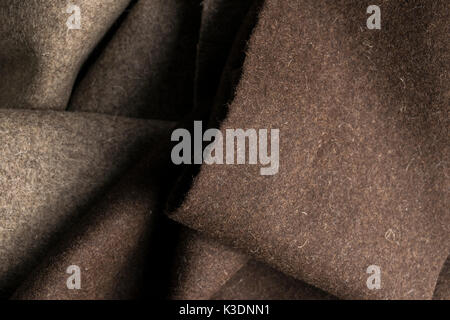 Crumpled felt fabric texture of natural brown fabric, cloth and furniture background. Stock Photo