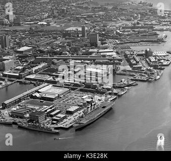Aerial view of Portsmouth Harbour and Naval Dockyard with the City of Portsmouth in the background, Portsmouth, Hampshire, England, UK - 13th May 1985 Stock Photo