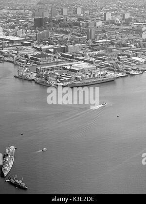 Aerial view of Portsmouth Harbour and Naval Dockyard with the City of Portsmouth in the background, Portsmouth, Hampshire, England, UK - 13th May 1985 Stock Photo