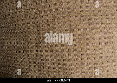 Crumpled fabric texture of natural beige and brown fabric, cloth and furniture background textile. Stock Photo