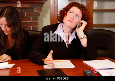 young office employee or boss frustrating conversation on phone Stock Photo