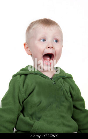 Wide eyed open mouthed smiling boy Stock Photo