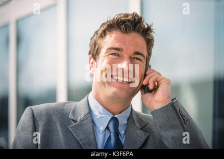 Businessman at mobile Stock Photo