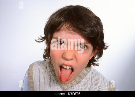 Boy sticks out tongue Stock Photo