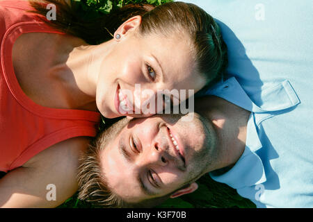 Young couple lies side by side closely packed Stock Photo