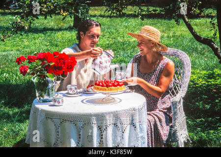 couple at the coffee drinking in the garden Stock Photo