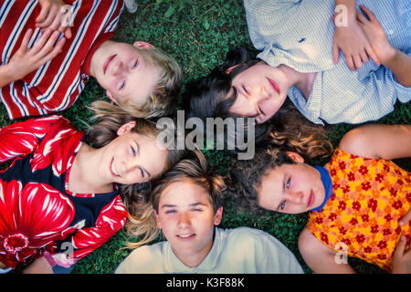 Group on the floor lying children / of young persons from the bird's-eye view Stock Photo