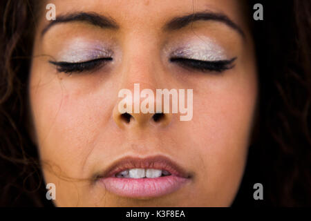 Close-Up Portrait of Woman with Eyes Closed Stock Photo