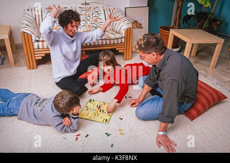 family at playing Ludo Stock Photo