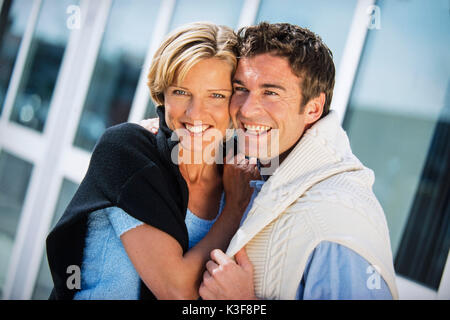 Couple laughs and embraces Stock Photo
