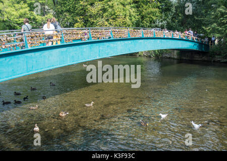 Padlocks on a footbridge over the river Wye at Bakewell in Derbyshire UK Stock Photo