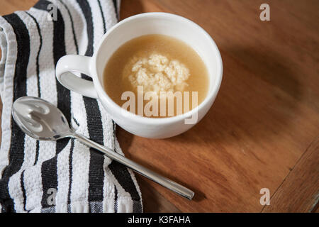 High Angle View of Cup of Matzah Ball Soup Stock Photo