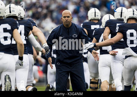 University Park, Pennsylvania, USA. 2nd Sep, 2017. September 02, 2017: Penn State Nittany Lions head coach James Franklin greets his players as they take the field during the NCAA football game between Penn State Nittany Lions and Akron Zips at Beaver Stadium in University Park, Pennsylvania. Credit: Scott Taetsch/ZUMA Wire/Alamy Live News Stock Photo